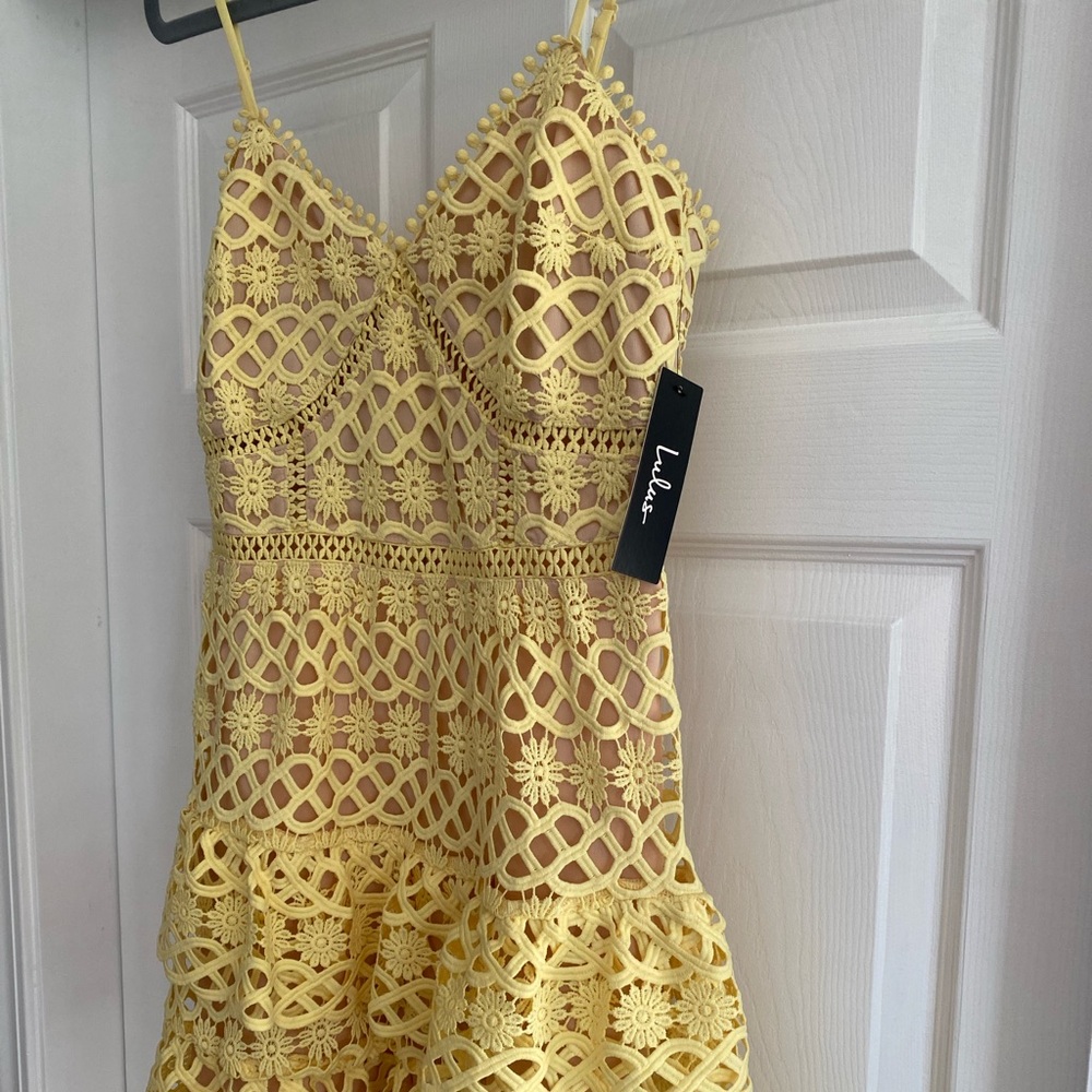 Yellow lace ruffle dress.